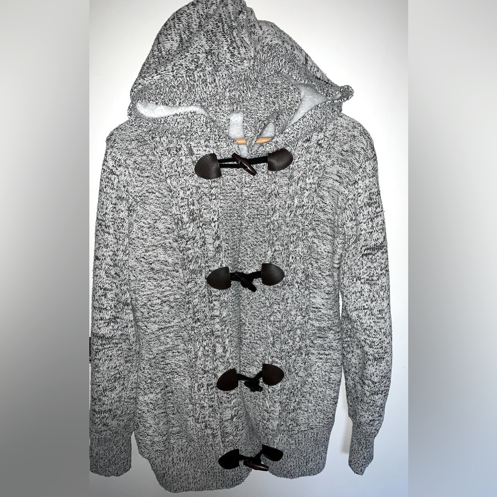 Beautiful winter Sherpa lined hoodie. Features nice brown closure details.